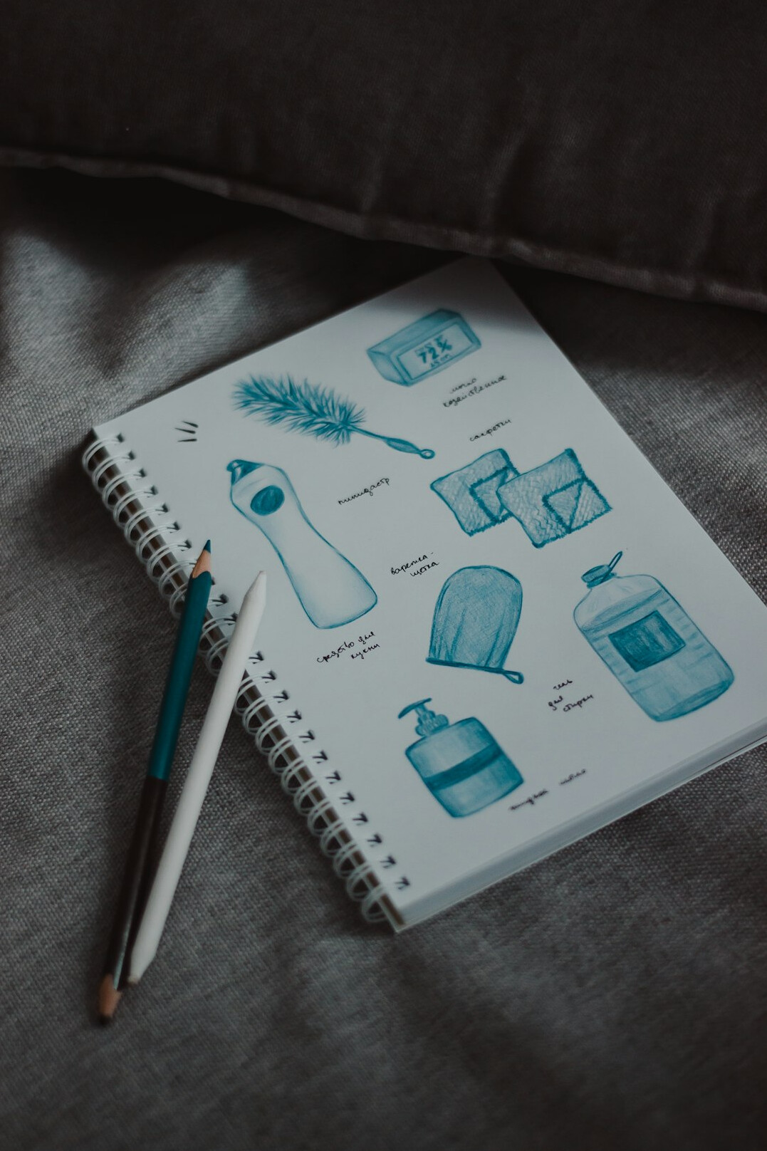 Hand-drawn flowchart diagram in a notebook with a pen