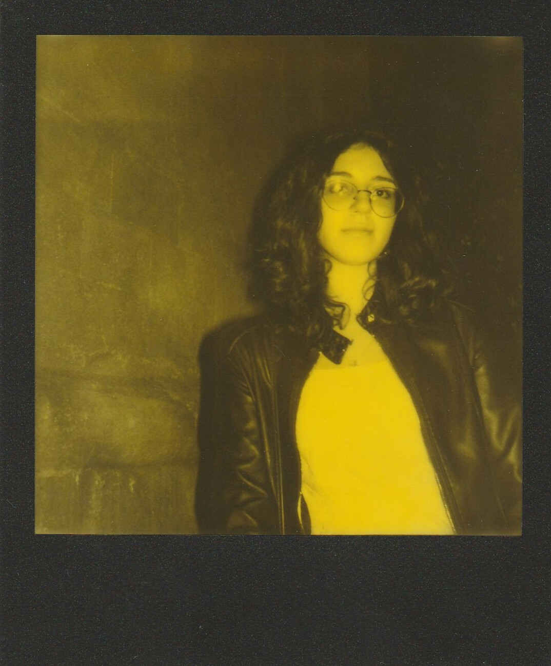 Studio portrait of a woman with glasses smiling