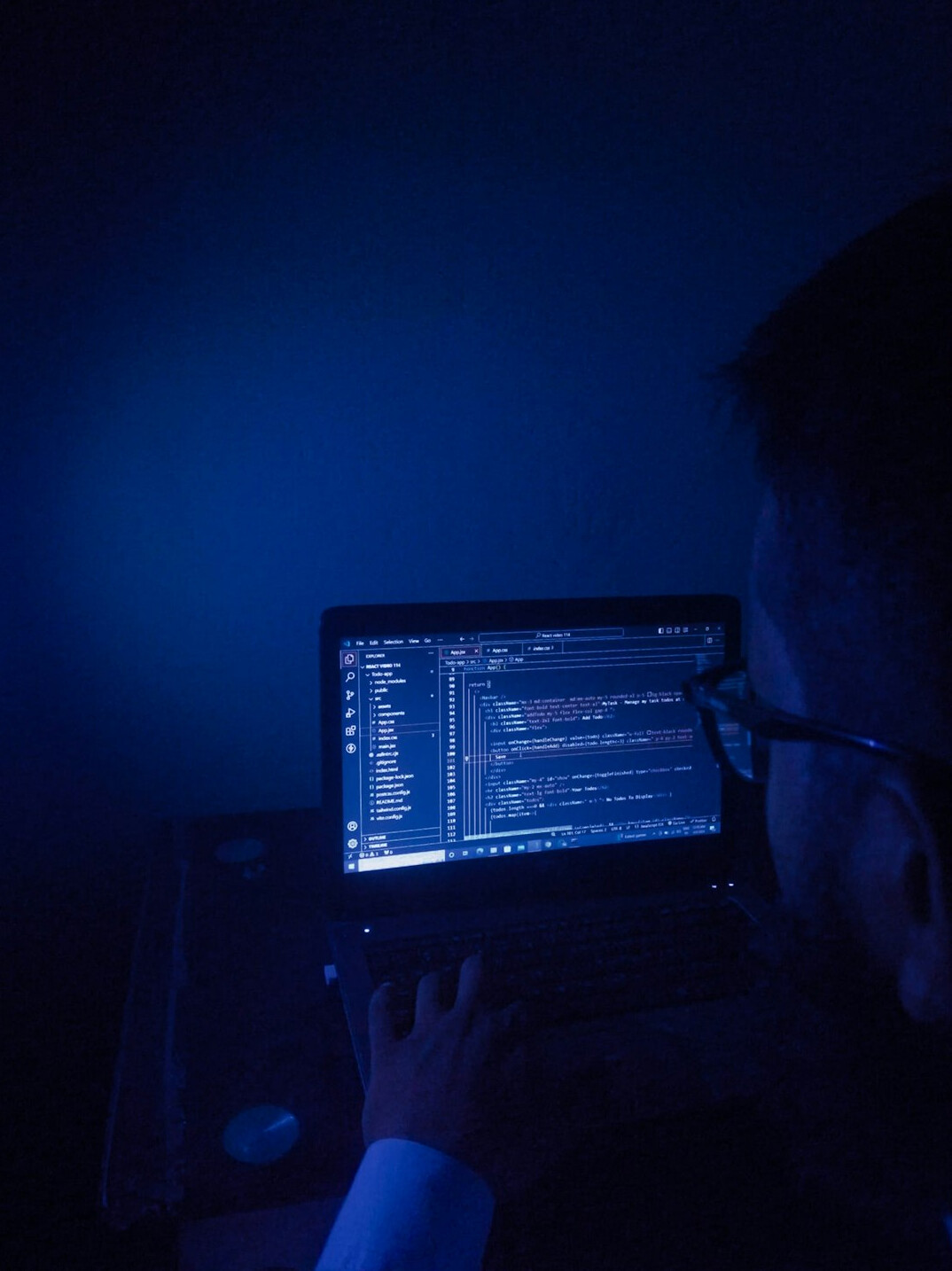 programmer working on laptop