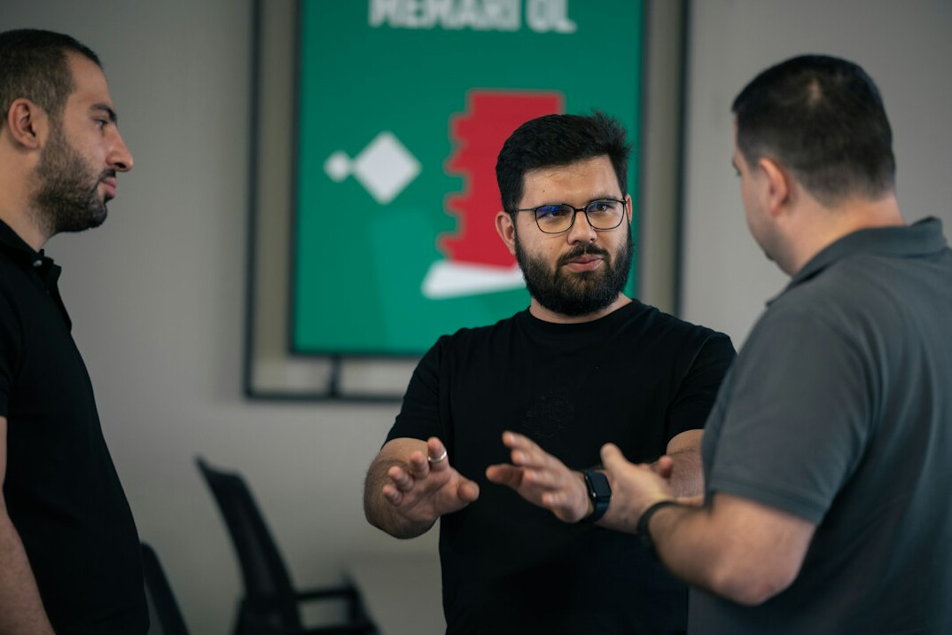 team discussing code in office