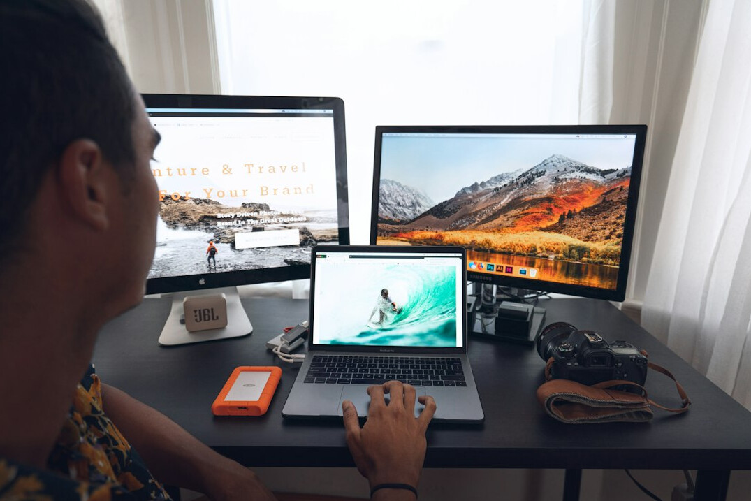 person coding at home desk