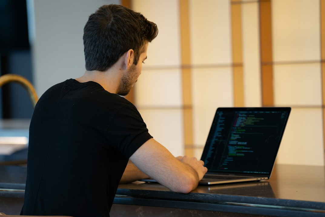 programmer working on laptop