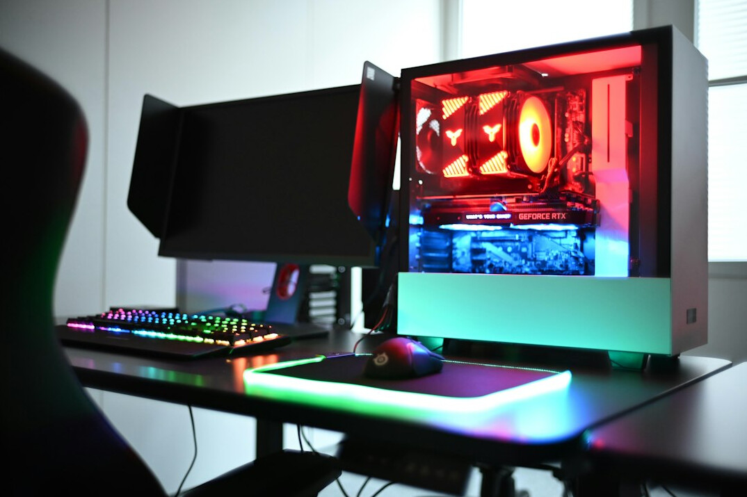 Dual monitor setup on a wooden desk