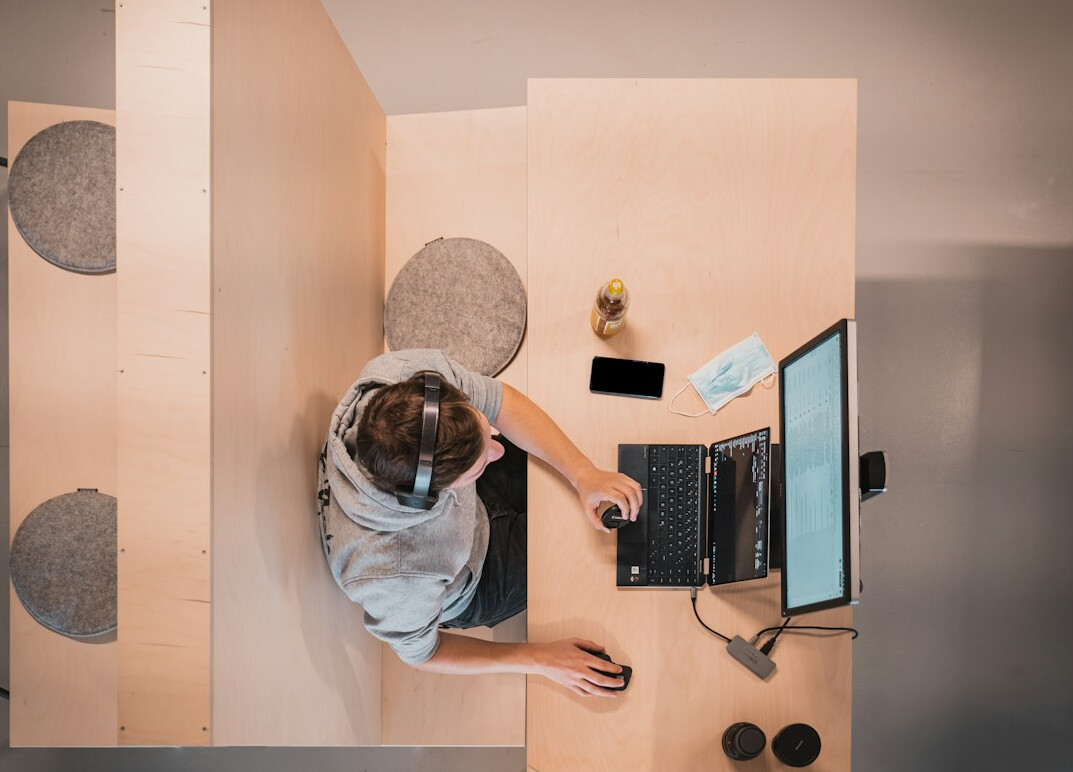 woman coding at desk